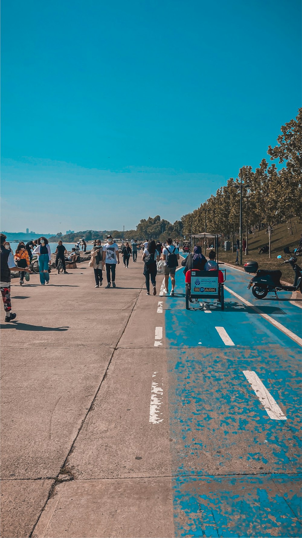 people standing on gray concrete road during daytime