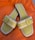 A satisfied customer showcasing her new sandals.