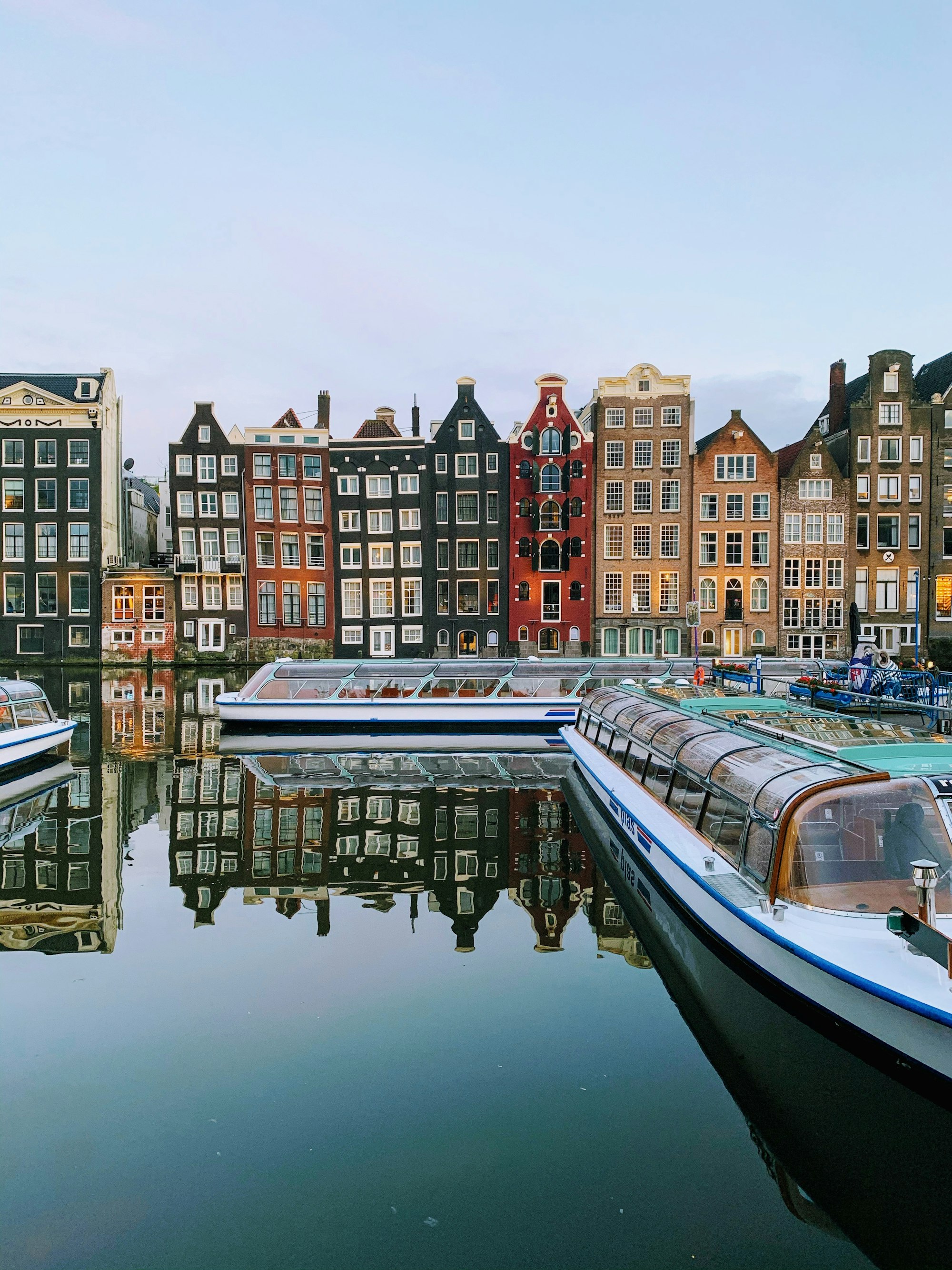 boat on water near buildings during daytime