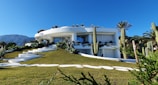white concrete building under blue sky during daytime