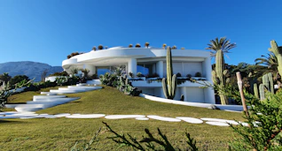 white concrete building under blue sky during daytime