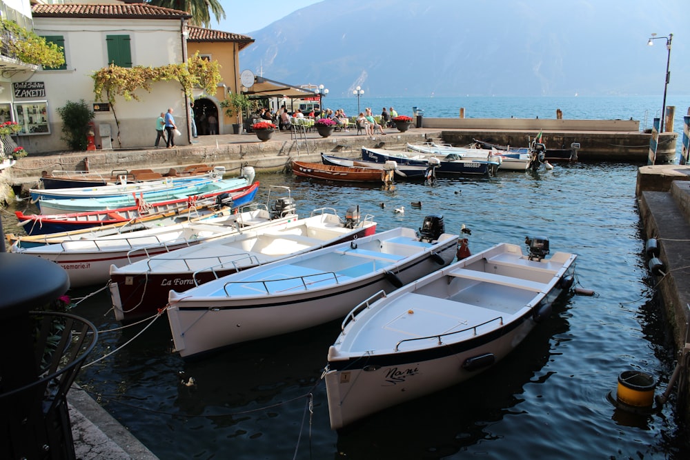 white and blue boat on sea during daytime