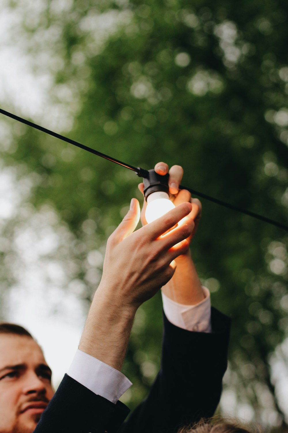 person holding black fishing rod