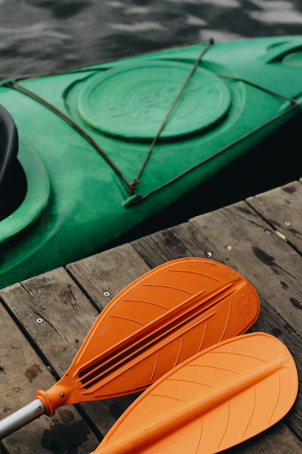 green and orange wooden boat