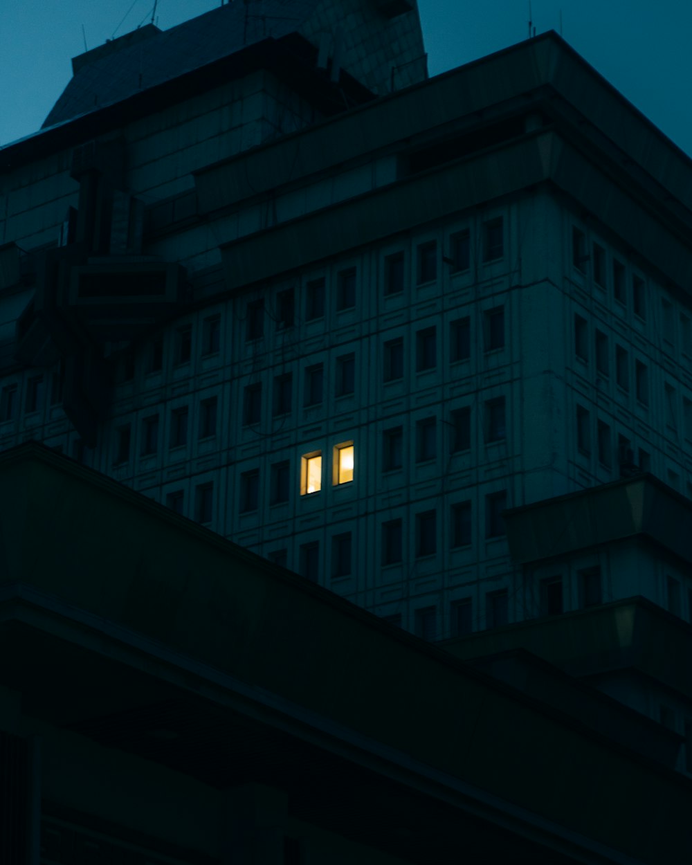 gray concrete building during night time