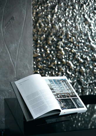 white book page on brown and black textile