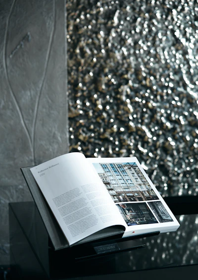 white book page on brown and black textile