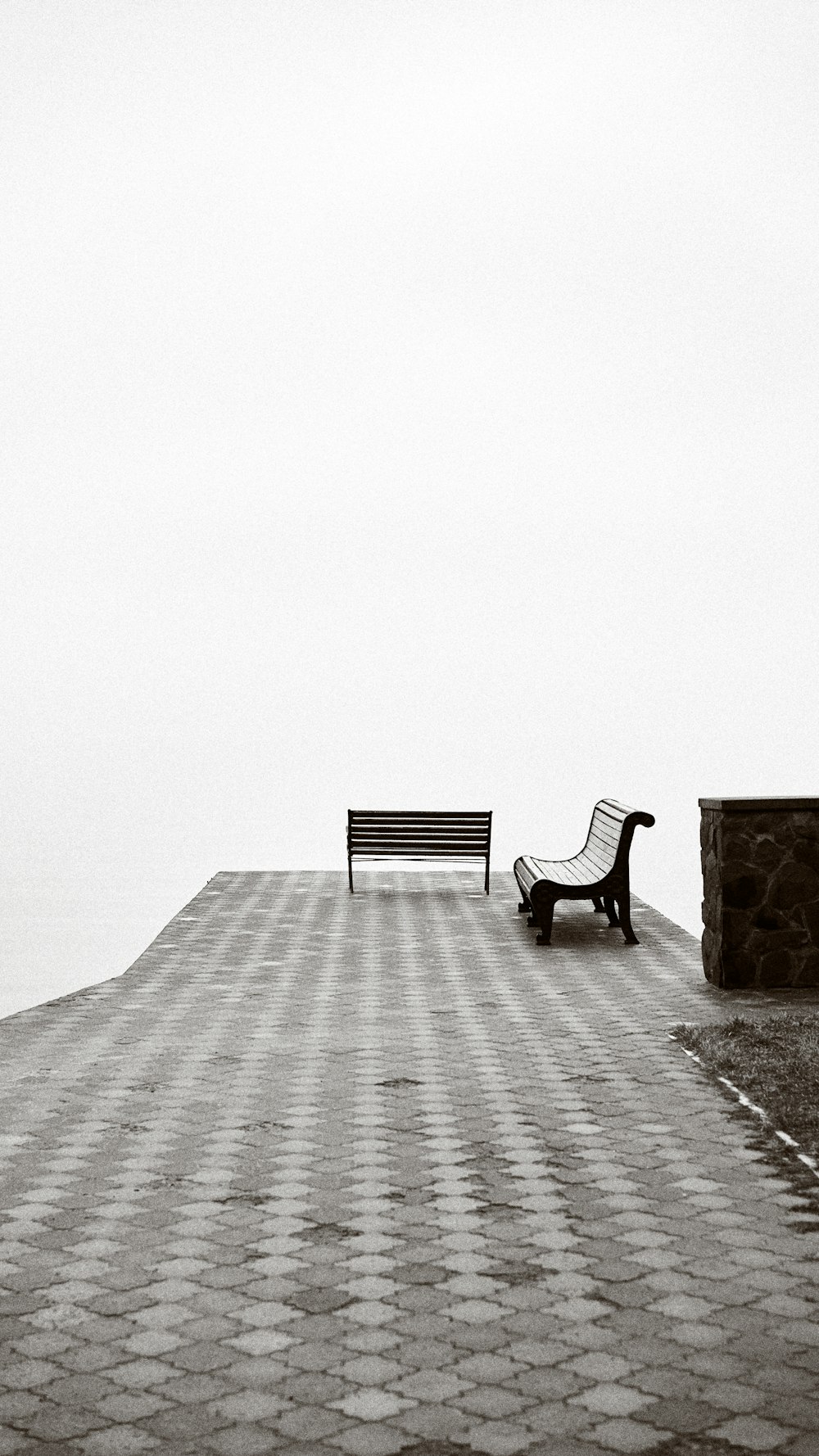 black metal bench on gray concrete floor