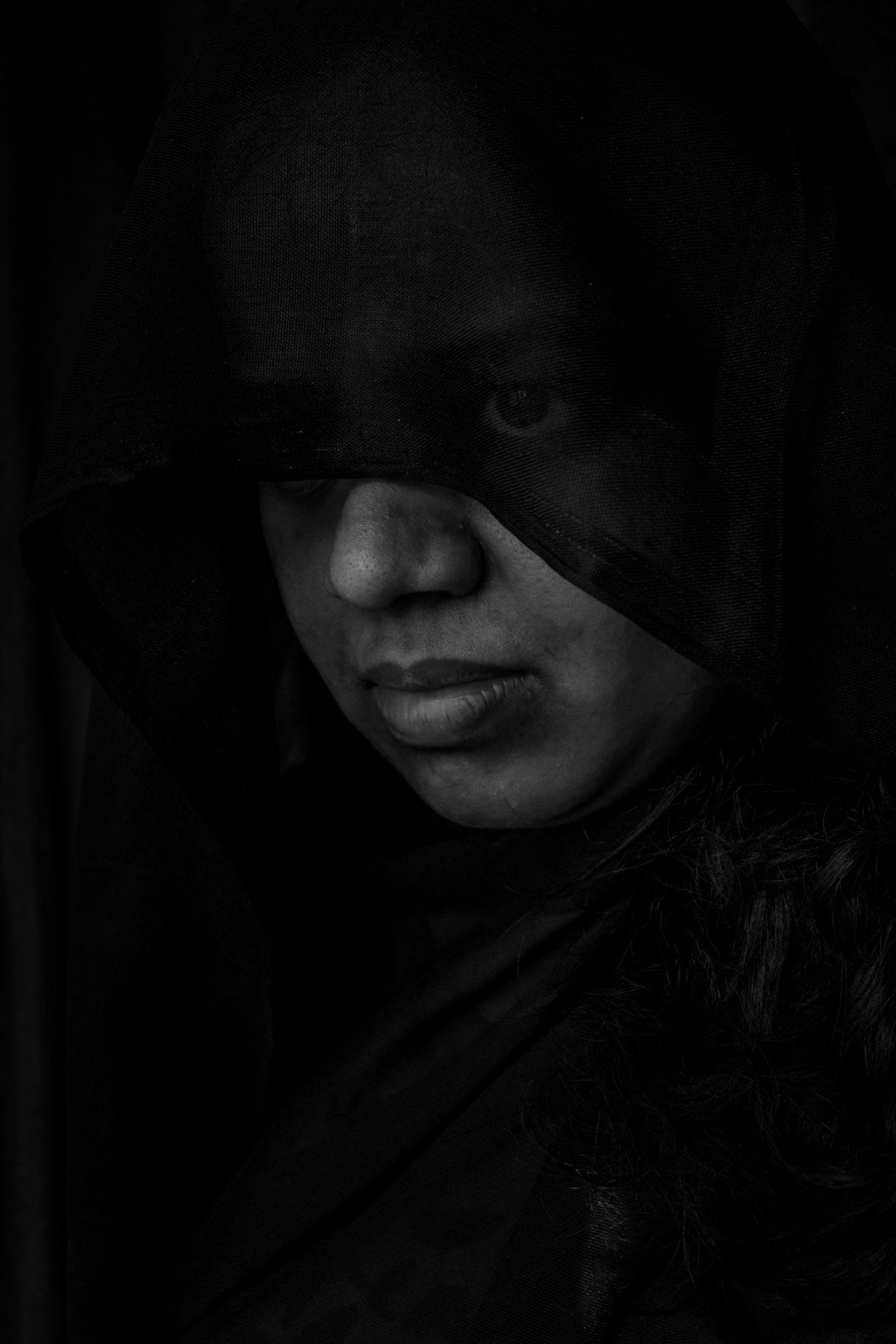 woman in black hijab in grayscale photography