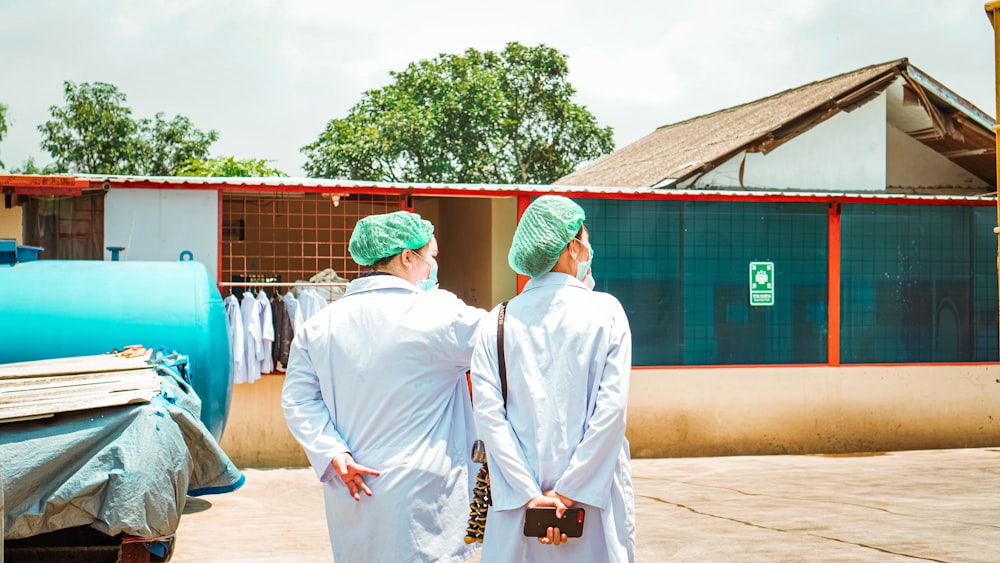 man in white thobe standing near people in white robe during daytime