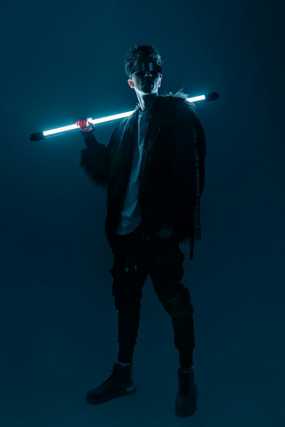 a man with a light saber in his hand