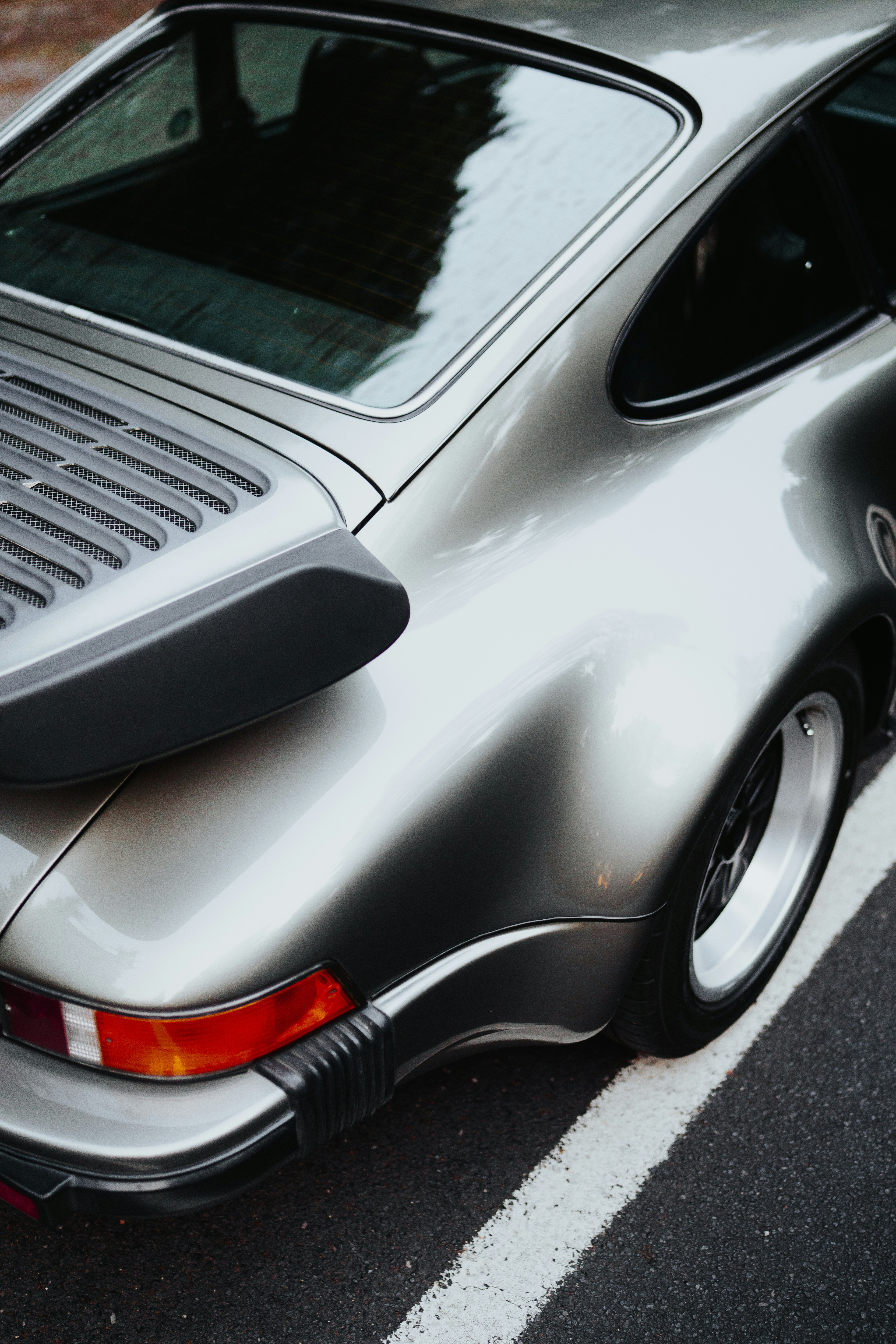 silver car on gray asphalt road