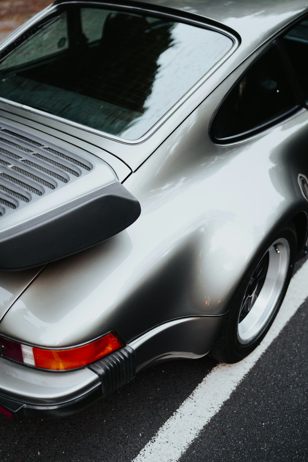 silver car on gray asphalt road