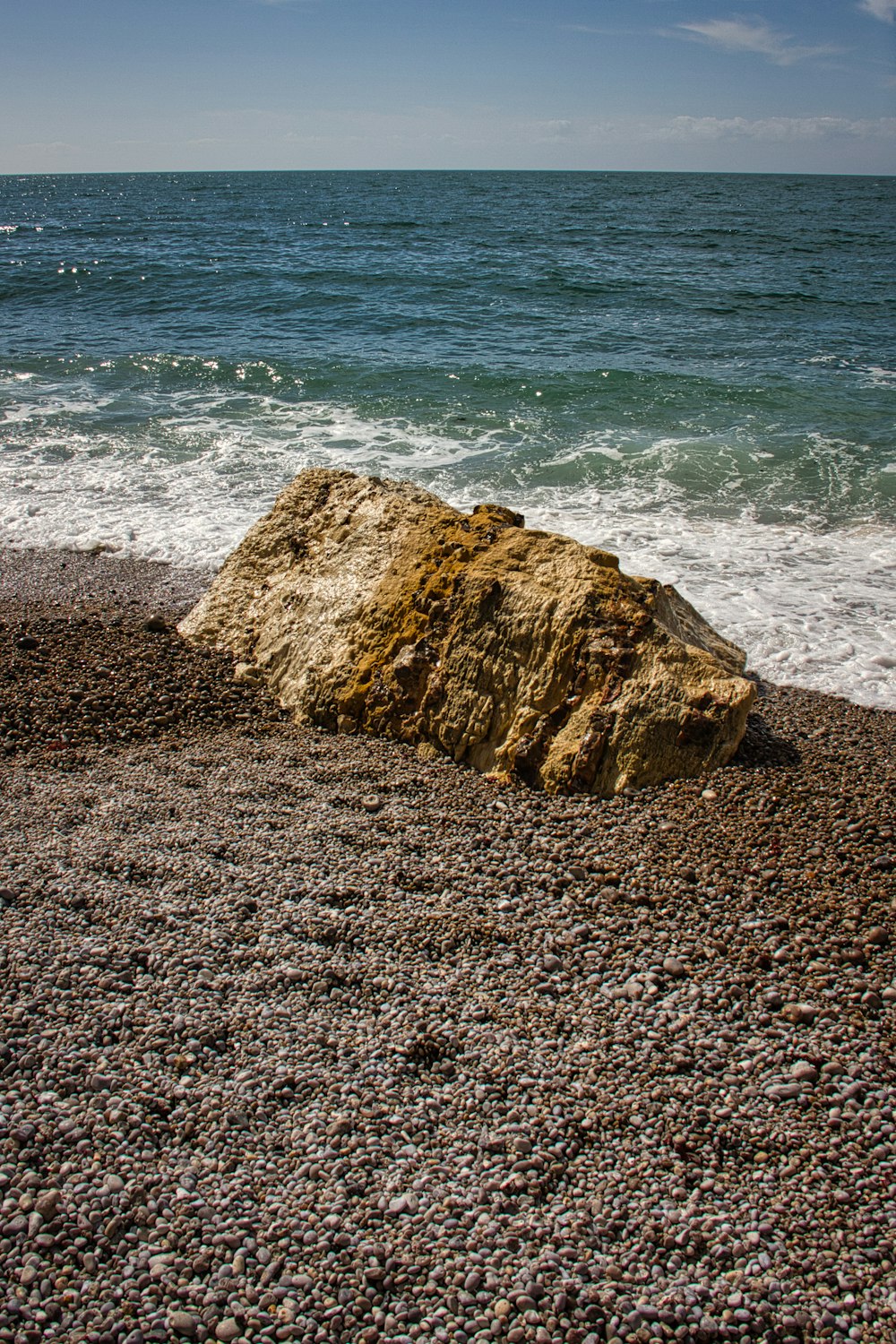 brown rock formation on seashore during daytime