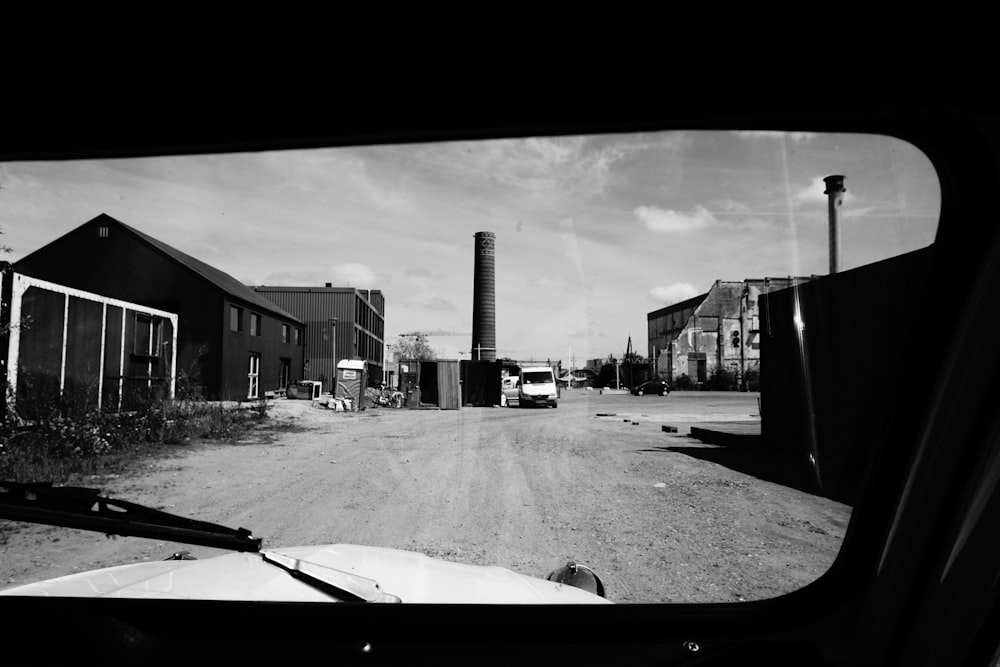 grayscale photo of car on road