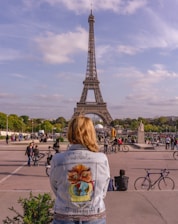 people sitting on bench near eiffel tower during daytime