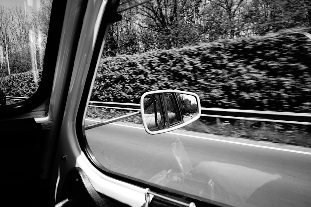 grayscale photo of car side mirror