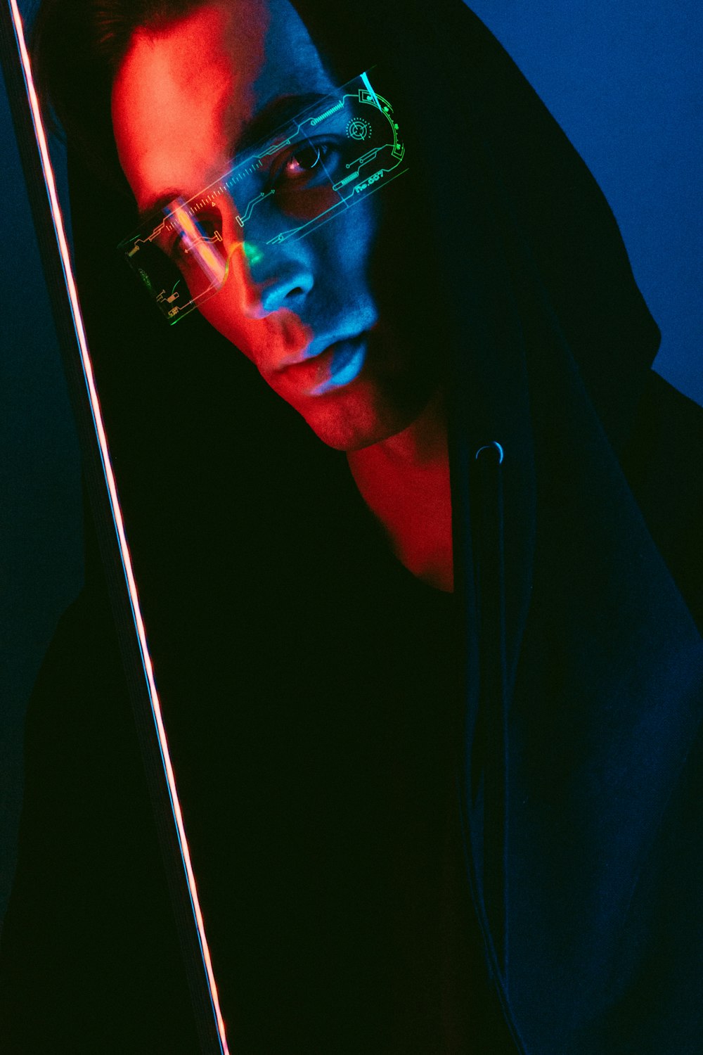 man in black hoodie wearing black framed eyeglasses