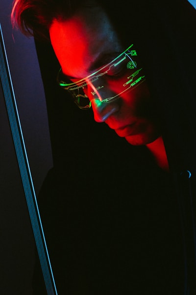 man in black framed eyeglasses looking at the window
