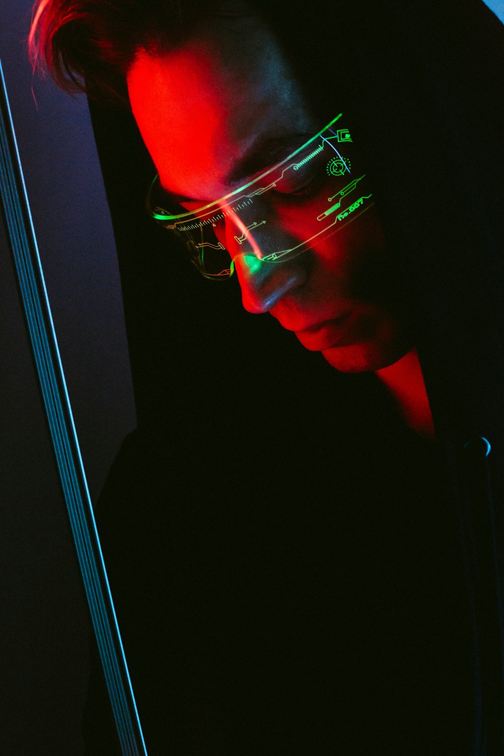 man in black framed eyeglasses looking at the window