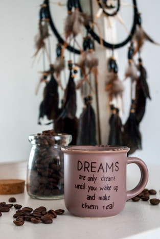 pink ceramic mug on brown wooden table