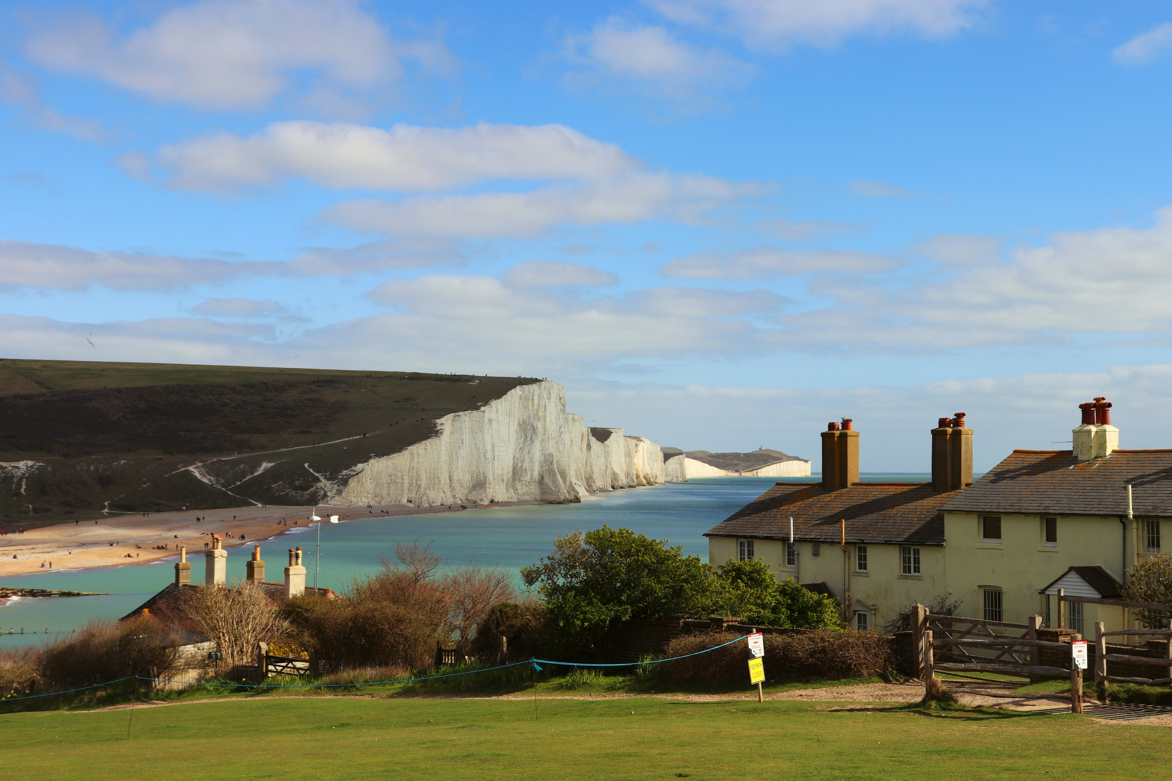 brown and white house near mountain during daytime