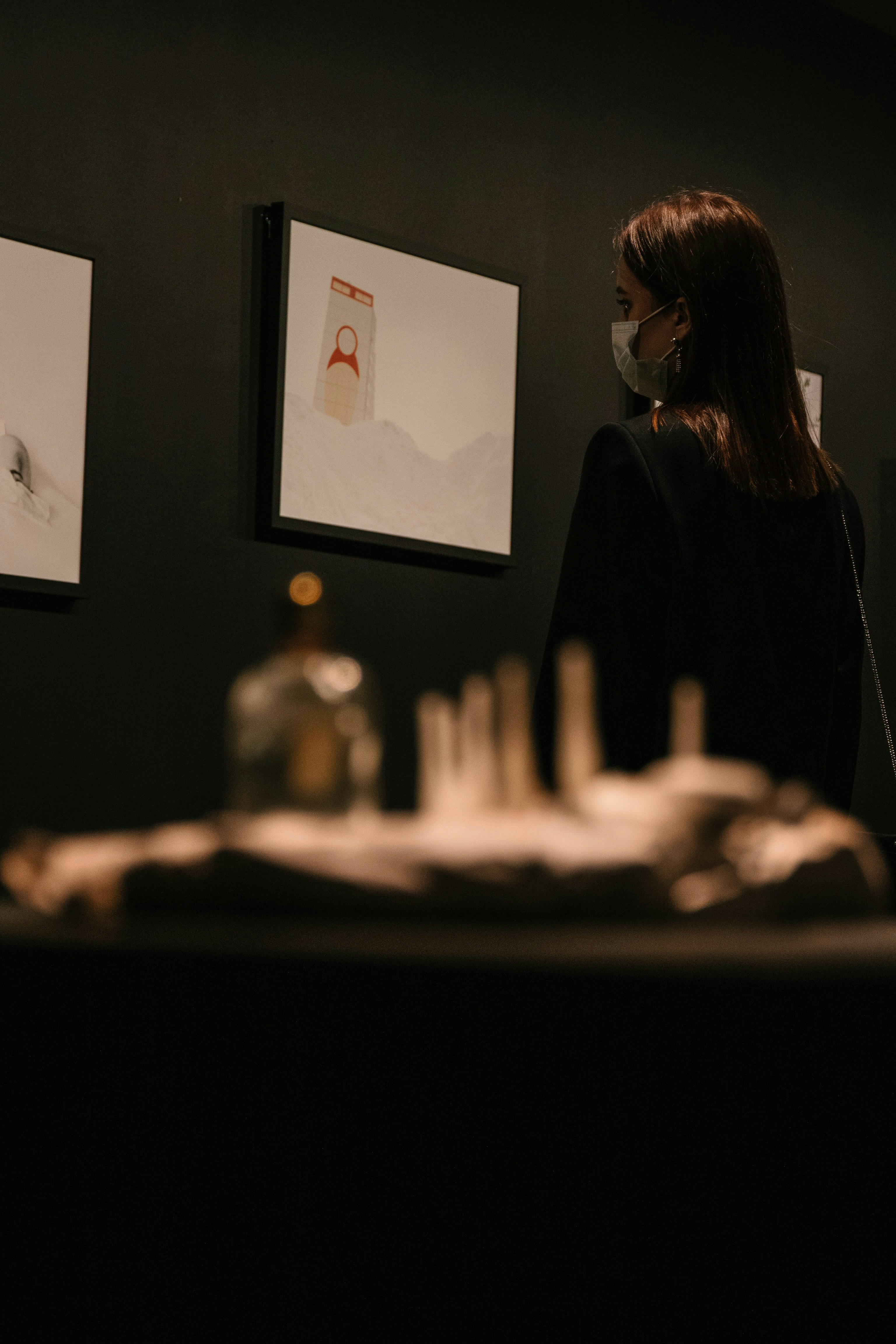 woman in black long sleeve shirt sitting by the table
