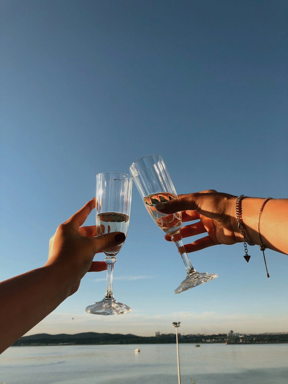 person holding clear wine glass