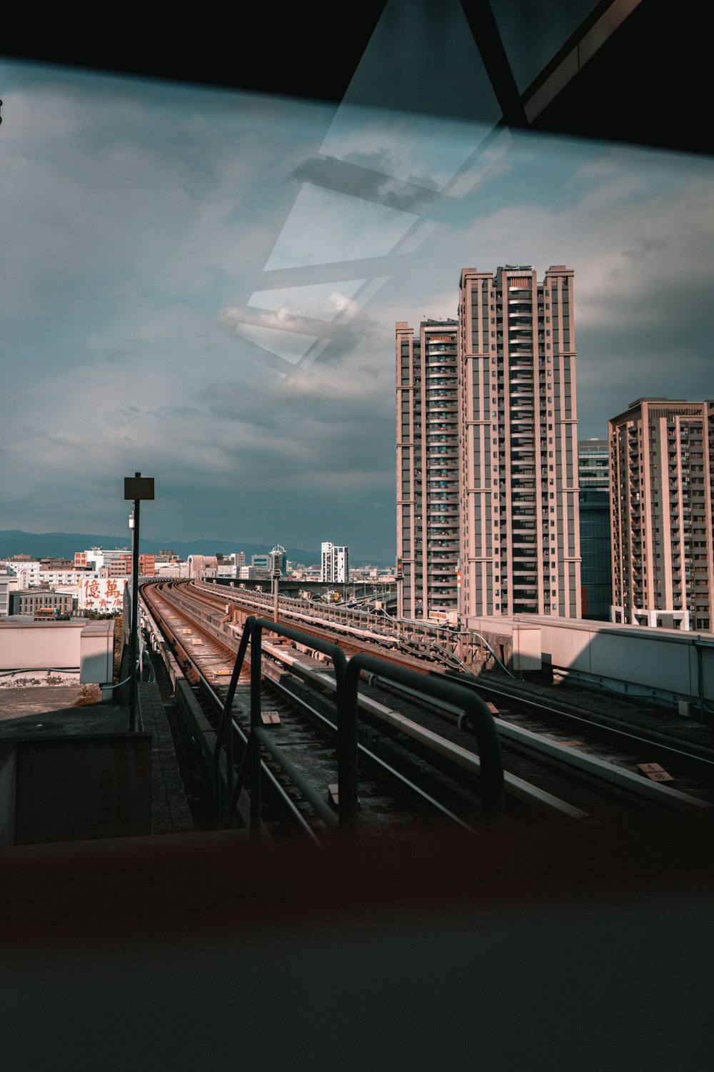 white and brown concrete building under cloudy sky during daytime