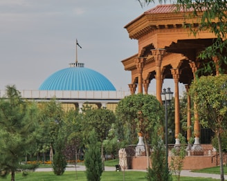 white dome building near green trees during daytime