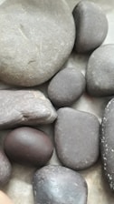 brown and gray stones on water