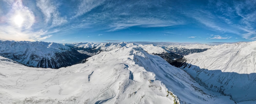 snow covered mountain under blue sky during daytime