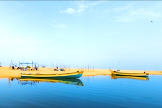 yellow and white boat on water during daytime