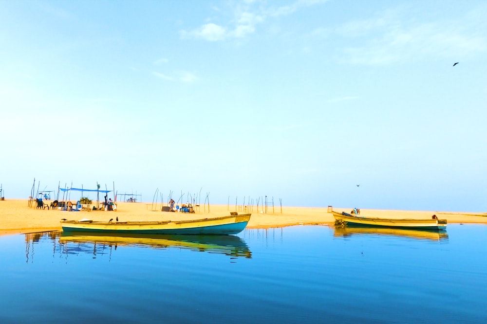 yellow and white boat on water during daytime