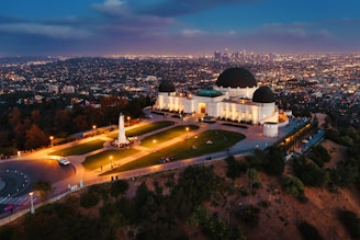 white dome building near green trees during daytime