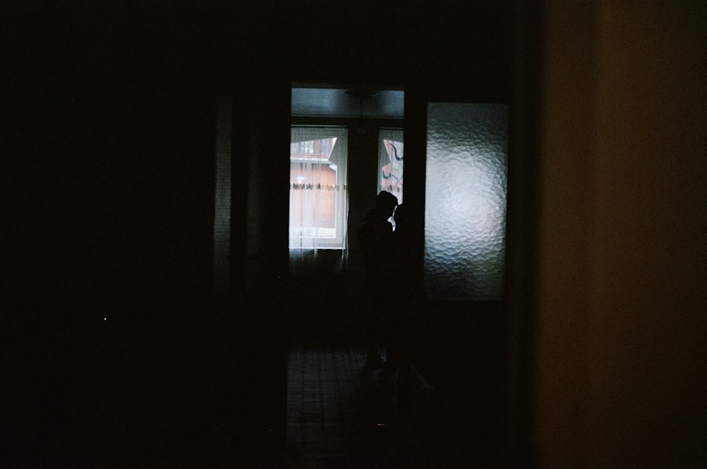 person standing in front of glass door