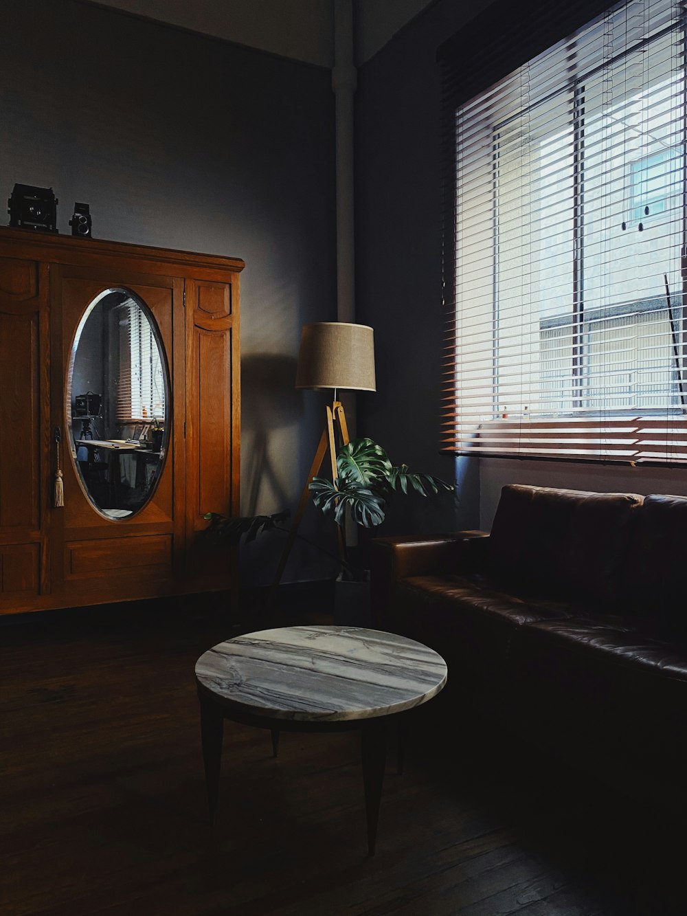 white and brown table lamp on brown wooden table