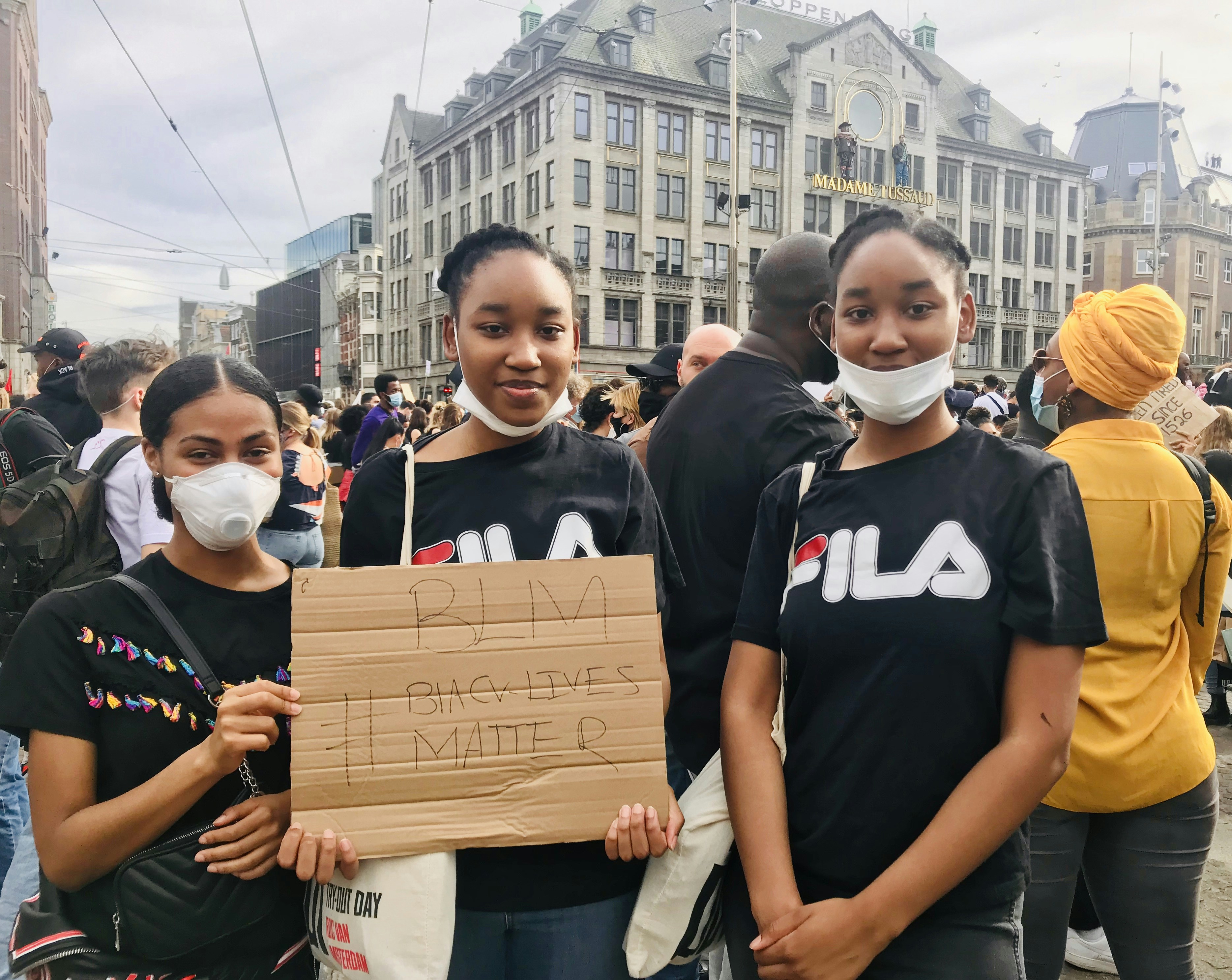 group of people standing on road during daytime