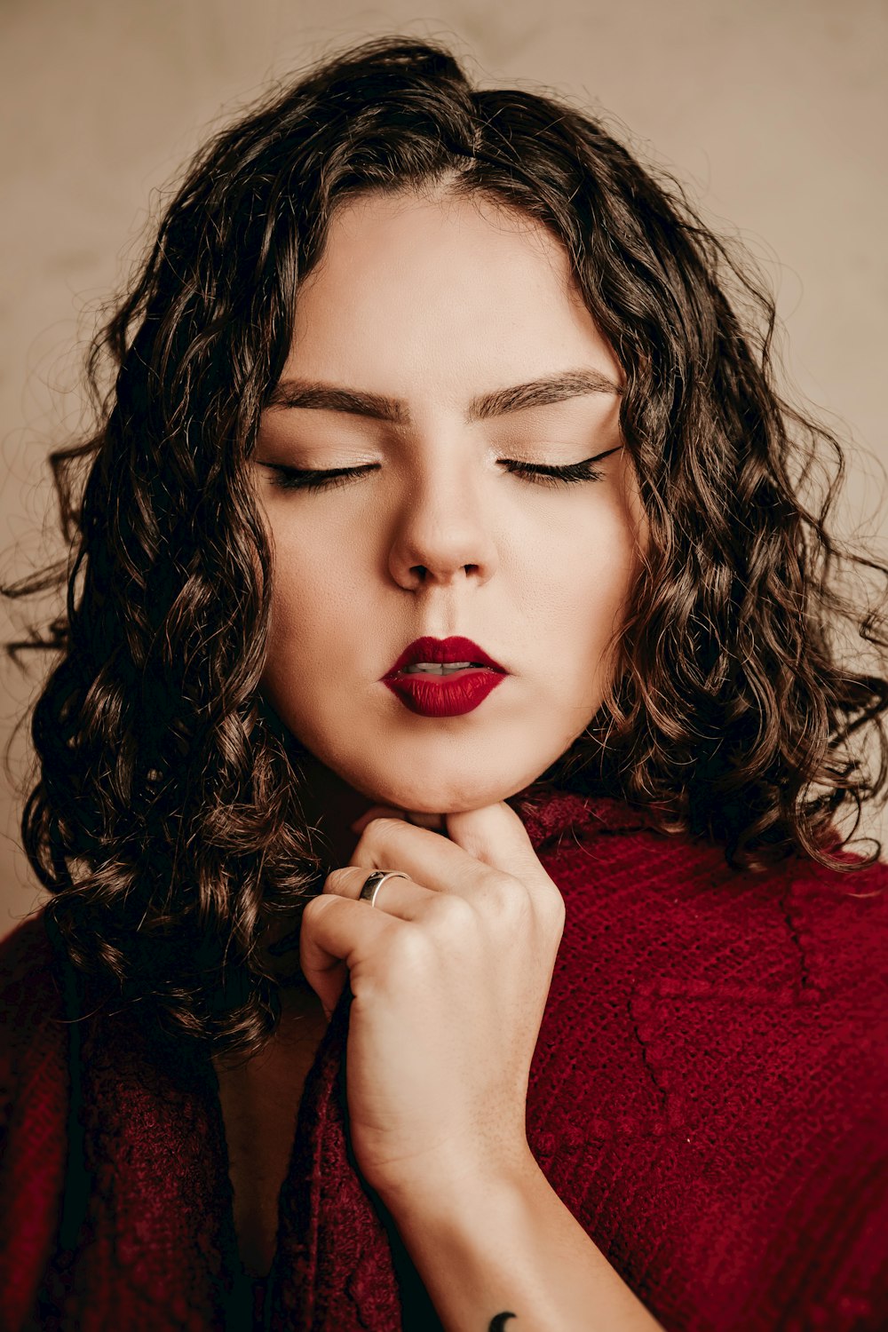 woman in red lipstick and red lipstick