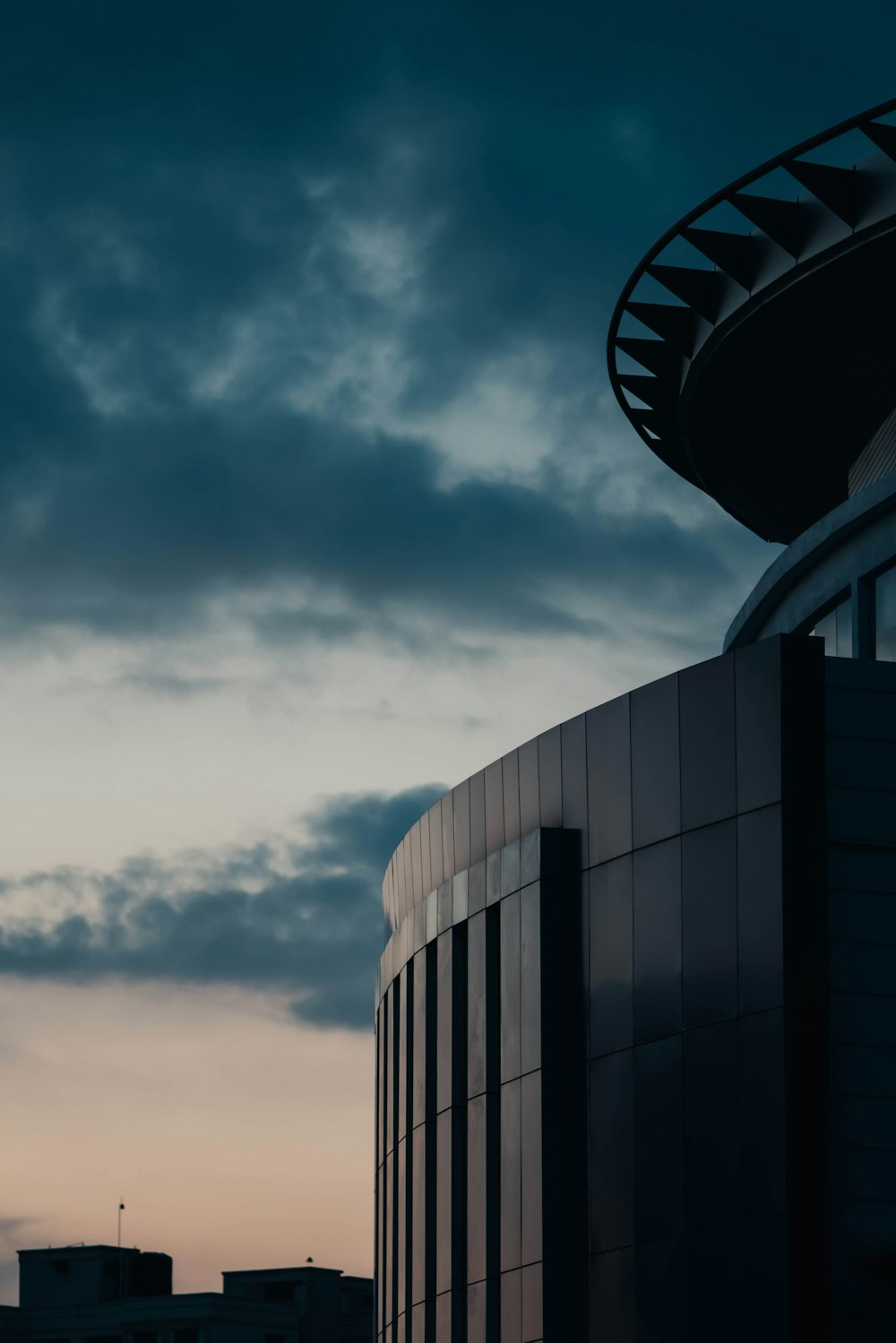 gray concrete building under gray clouds