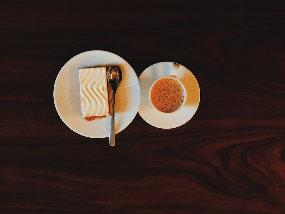 white ceramic plate with stainless steel fork and knife