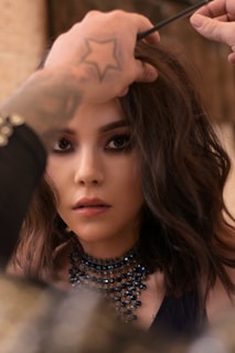 woman in black and white polka dot shirt