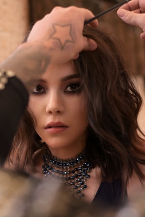 woman in black and white polka dot shirt