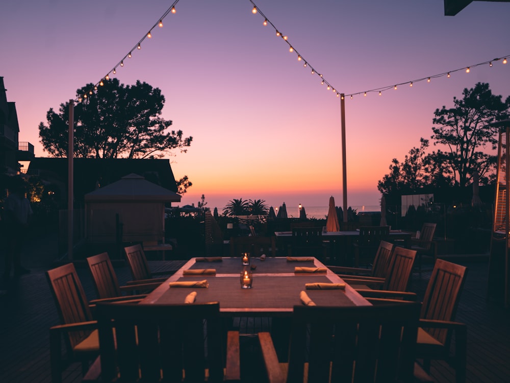 brown wooden table with chairs