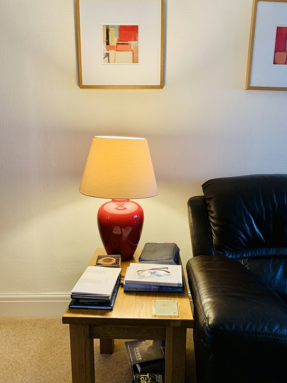 red and white table lamp on brown wooden table