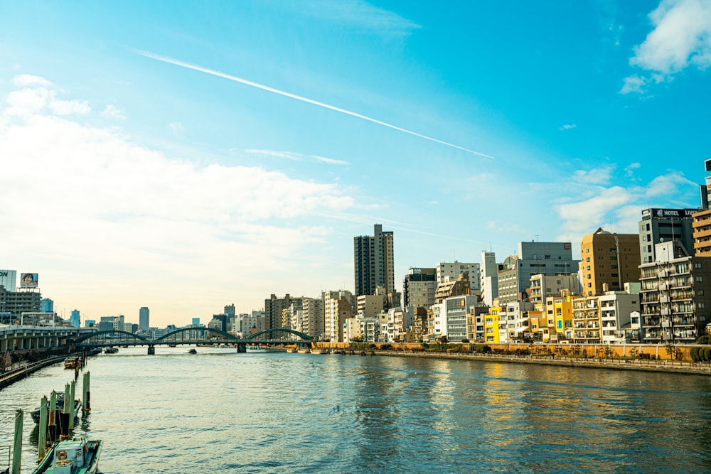 city skyline across body of water during daytime