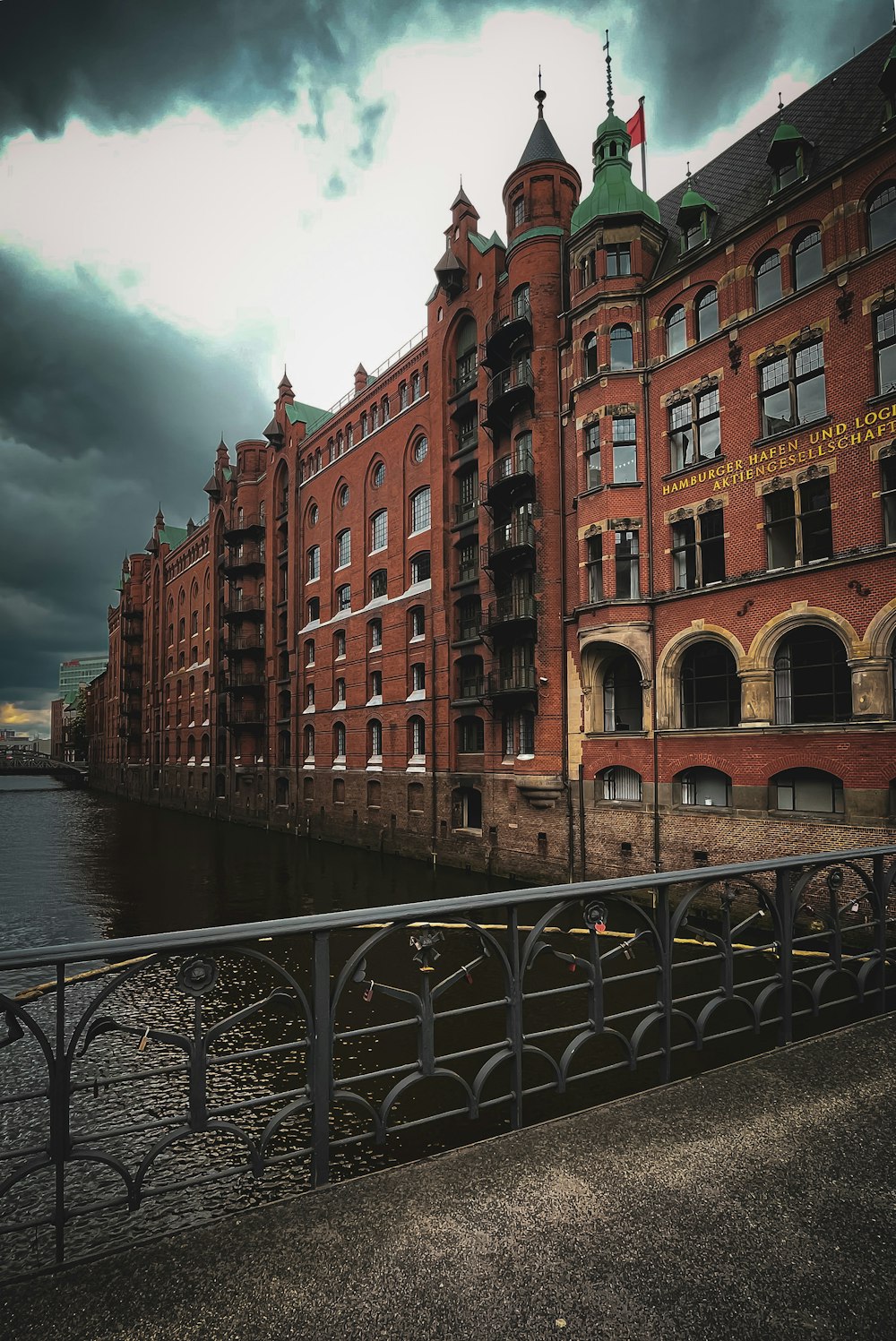 brown concrete building near body of water during daytime