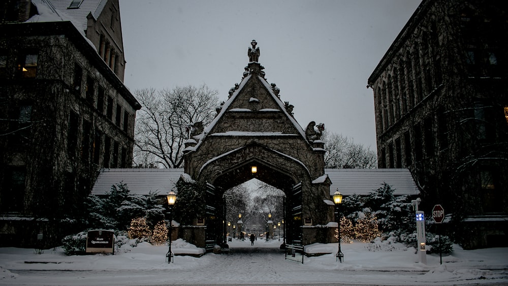 brown and gray concrete building covered with snow during daytime