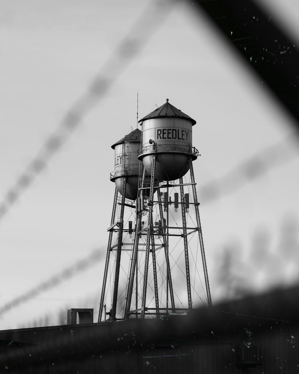 grayscale photo of water tank