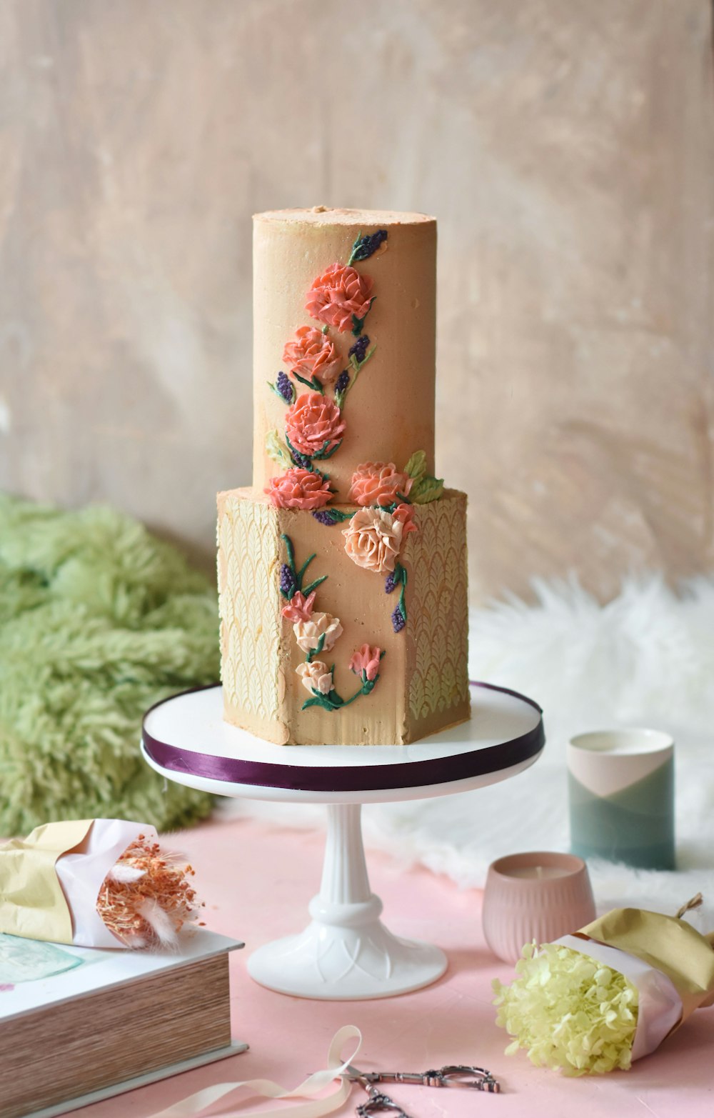 brown and red floral cake on white ceramic plate